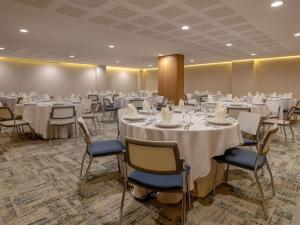 a banquet room with white tables and chairs at Novotel Bogota Parque 93 in Bogotá +149 photos