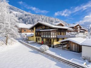 a lodge in the snow with snow covered at Elisabeth II in Wald im Pinzgau