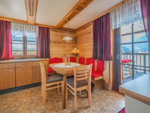 a dining room with a table and chairs at Elisabeth II in Wald im Pinzgau