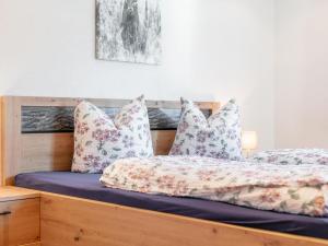 a bedroom with two beds with pillows at Apartment Birgit in Zellberg