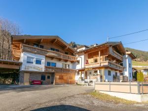 a house in the mountains with a driveway at Apartment Birgit in Zellberg