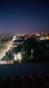 a view of a city at night with lights at Dar D'Asilah in Asilah +13 photos