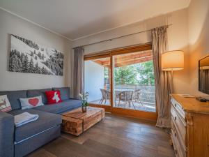 a living room with a couch and a table at Kitz Apartments Top 7 in Kitzbühel