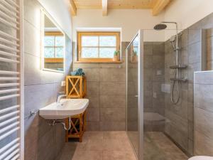 a bathroom with a sink and a shower at Riesner Alpenlodge in Donnersbachwald +41 photos