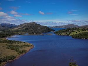 an aerial view of a river with mountains in the background at Chalé Lumiar in Santana do Riacho +4 photos