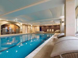 a large swimming pool in a hotel room at Mercure Barnsley Tankersley Manor Hotel in Barnsley
