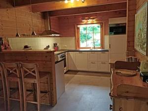 a kitchen with a counter and a stove top oven at Le Temps-Passe in Saint-Jean-d'Aulps
