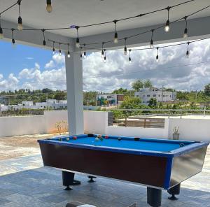 a pool table on a patio with a view at Byk in Nagua