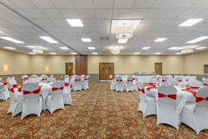 a banquet hall with white tables and chairs at Best Western Plus Wooster Hotel & Conference Center in Wooster