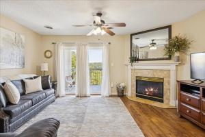 a living room with a couch and a fireplace at WP141 City Lights in Pigeon Forge