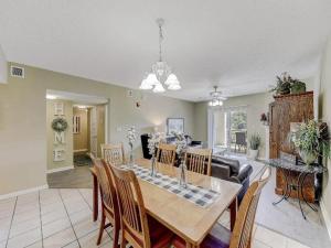 a dining room and living room with a table and chairs at WP531 Come on Inn in Pigeon Forge