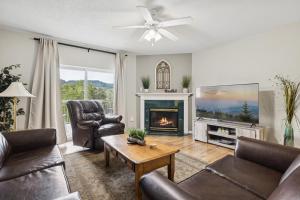 a living room with a couch and a fireplace at WP521 We've Got It All in Pigeon Forge