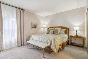 a bedroom with a bed and a window at WP521 We've Got It All in Pigeon Forge +33 photos