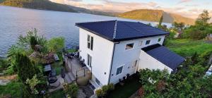 an aerial view of a house with a solar roof at Bergen sunrise Apartment - self check in - Free Parking in Bergen
