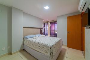 a bedroom with a large bed in a room at Apartamento a beira-mar com piscina in Cabedelo +65 photos