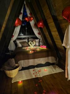 a bedroom with a bed with lights on it at Chales Holanda in Pirenópolis