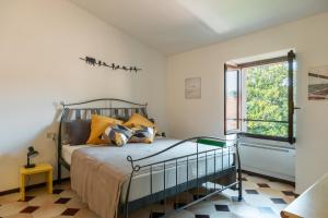 a bedroom with a bed and a window at Casa Anna in Paratico +48 photos