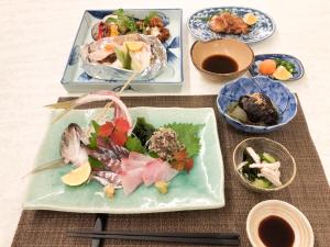 a table with three plates of food on it at ハーミットクラブ in Goto +37 photos