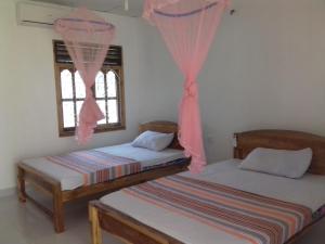 Voodi või voodid majutusasutuse Hotel Sea Shadow toas