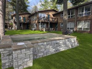a house with a swimming pool in the yard at Tiny Loft-Spider Lake-SUP Rentals-Beach-10mi to TC in Traverse City
