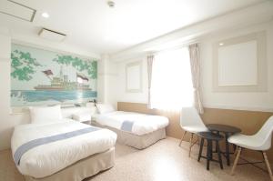 Postel nebo postele na pokoji v ubytování Hotel Imalle Yokohama Isezakicho