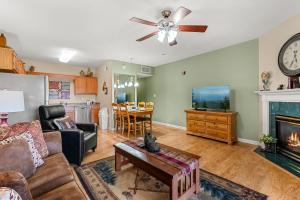 a living room with a couch and a fireplace at WP231 Old Mill Overlook in Pigeon Forge