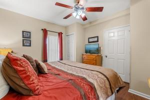 a bedroom with a bed and a ceiling fan at WP231 Old Mill Overlook in Pigeon Forge +17 photos