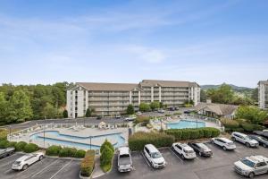 an aerial view of a hotel with cars parked in a parking lot at WP231 Old Mill Overlook in Pigeon Forge