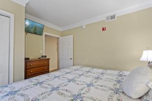 a bedroom with a bed and a dresser at WP431 Private Sunsets in Pigeon Forge +33 photos