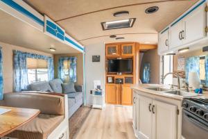a kitchen and living room of a caravan at Poop Deck in Fort Bragg