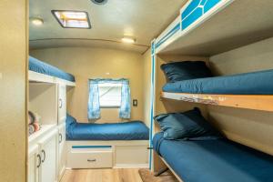 a small room with two bunk beds in it at Poop Deck in Fort Bragg
