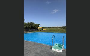 a view of a swimming pool with blue water at Pearl Escape in Entebbe