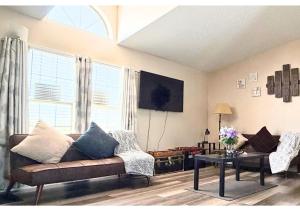 a living room with a couch and a table at Pahrump Vacation House #1, DeathValley-Las Vegas, Readaways-Healthy Mind in Pahrump