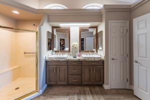 a bathroom with two sinks and a shower at Lake House in Fort Mohave +36 photos