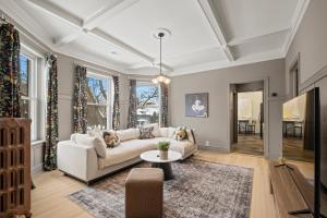 a living room with a couch and a table at Elegant and Chic 2Bed 2Bath steps from the lake! in Chicago