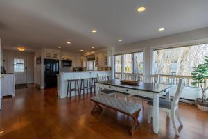 a kitchen and dining room with a table and chairs at Blue Ridge Vista in Seven Devils