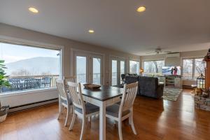 a dining room with a table and chairs and a couch at Blue Ridge Vista in Seven Devils +36 photos