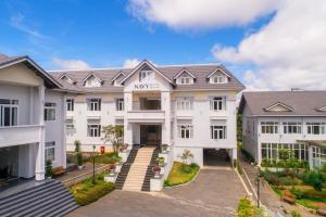 an image of a large white building at Navy Hotel Da Lat in Da Thien
