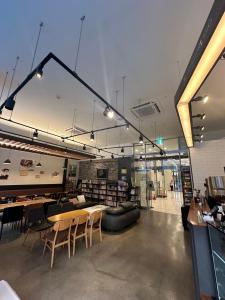 a room with chairs and tables in a library at Gold Coast Hotel Incheon in Incheon