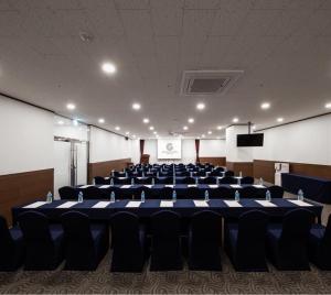 a large conference room with a blue table and chairs at Gold Coast Hotel Incheon in Incheon +61 photos
