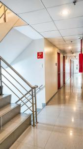 a hallway of a building with stairs and a stair case at ML SUITES CEBU in Cebu City