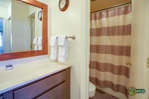 a bathroom with a sink and a mirror at Aspen East Unit #101 in Basye +13 photos