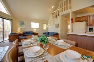 a dining room and kitchen with a table and chairs at Villa #91 in Basye
