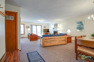a living room with a blue couch and a table at Villa #114 in Basye +21 photos