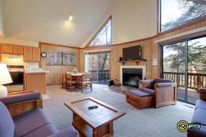 a living room with a couch and a table at Villa #119 in Basye