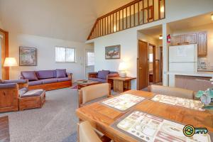 a living room with a table and a couch at Villa #119 in Basye
