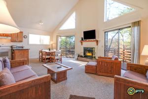 a living room filled with furniture and a fireplace at Villa #102 in Basye +20 photos