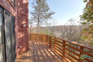 a wooden deck with a view of the mountains at Villa #364 in Basye