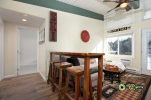 a living room with a table and a couch at Aspen East Unit #231: Slippery Slope in Basye +25 photos