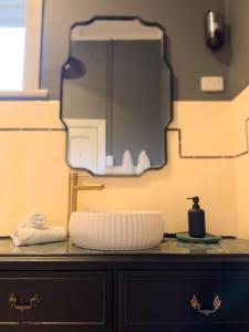 a bathroom counter with a sink and a mirror at Forrest House Victor Harbor in Victor Harbor +37 photos